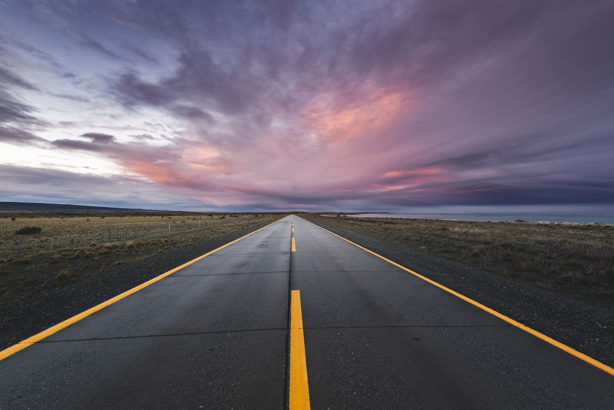 empty paved road at sunset in the chilean patagonia