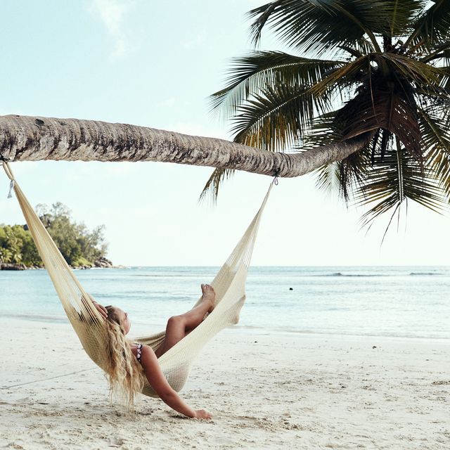 woman on beach in hammock