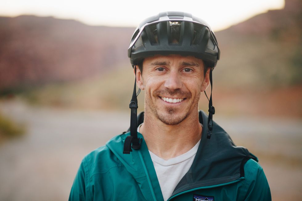 braydon bringhurst smiling and wearing bike helmet in moab, utah