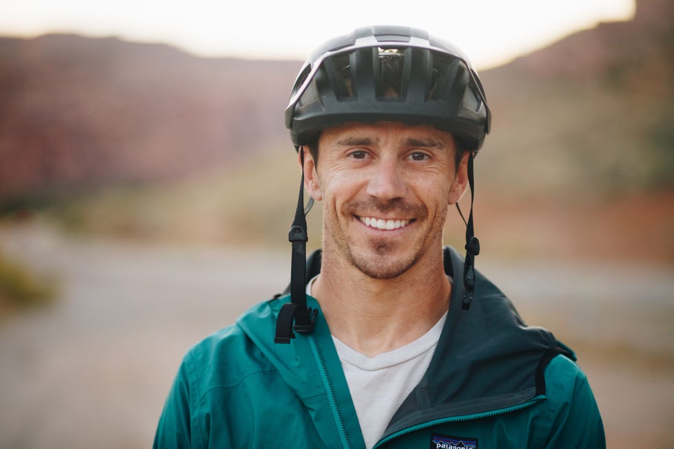 braydon bringhurst smiling and wearing bike helmet in moab, utah