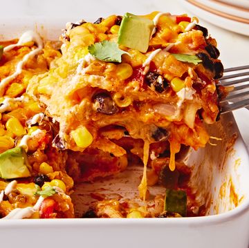 enchilada fillings in a casserole topped with avocado cubes