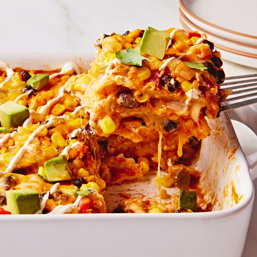 enchilada fillings in a casserole topped with avocado cubes
