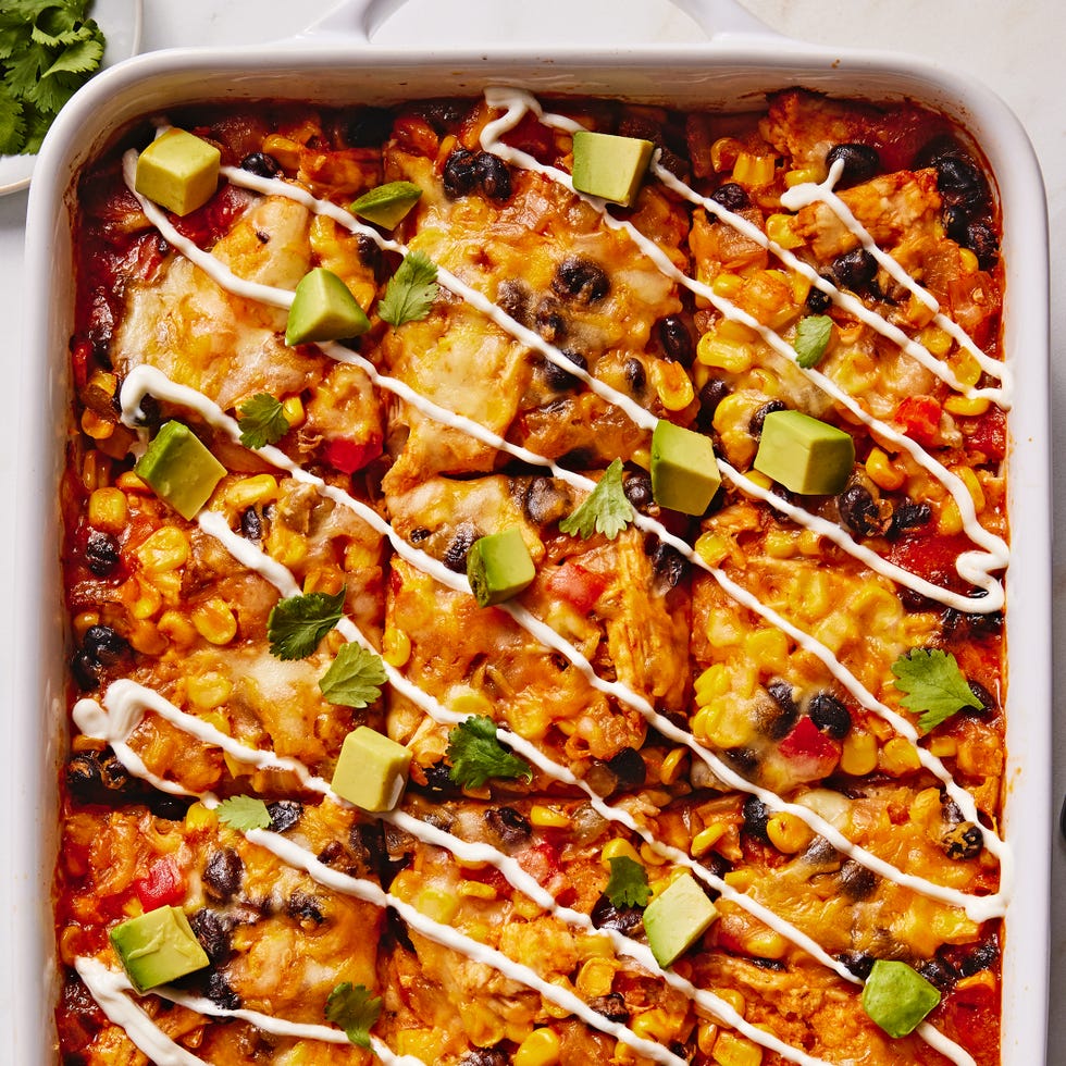 Enchilada Casserole enchilada fillings in a casserole topped with avocado cubes