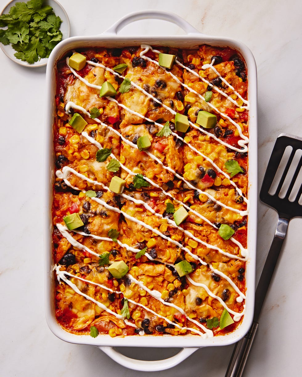 enchilada fillings in a casserole topped with avocado cubes