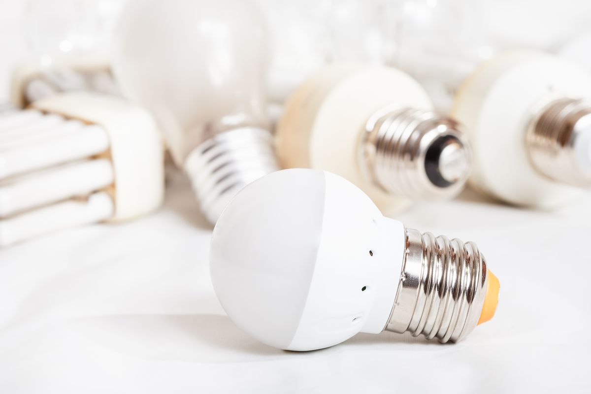 energy saving LED lamp and several old light bulbs