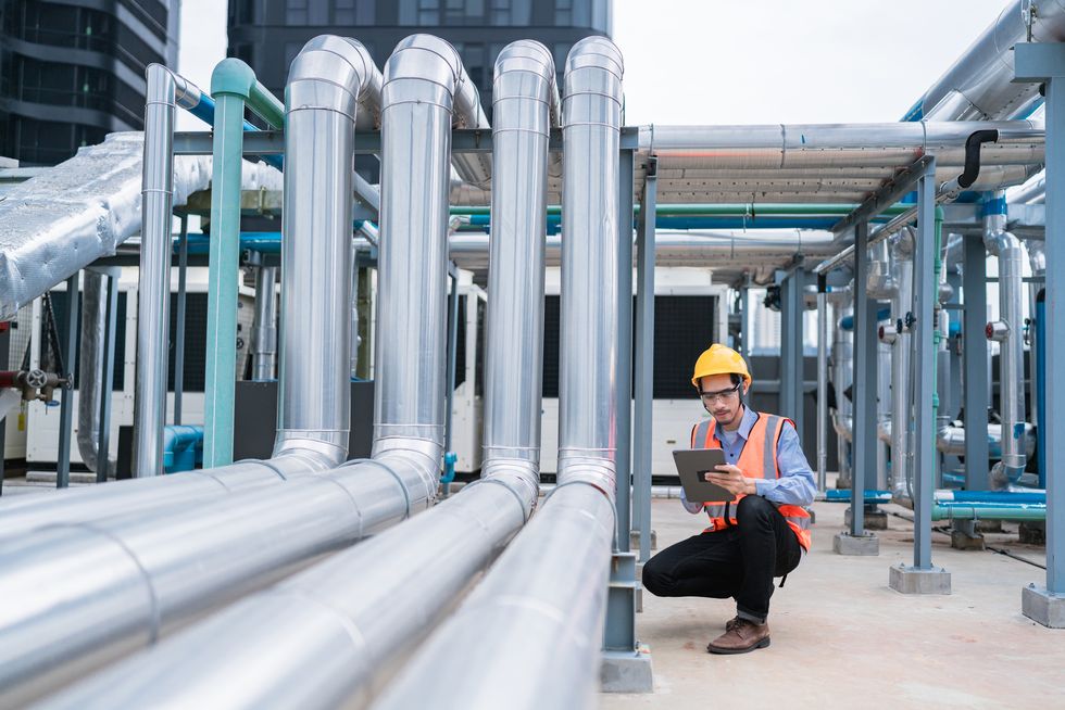 engineer checking pipelines in a facility