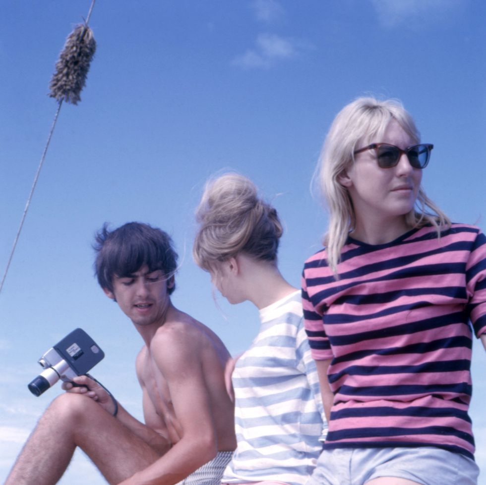 papeete, tahiti may 1964 lr english musician, singer, songwriter, guitarist and member of the beatles george harrison 19432001, his wife, pattie boyd, and john lennon's wife, cynthia lennon, relaxing on a sailboat while on vacation in papeete, tahiti in french polynesia, may 1964 photo by icon and imagegetty images