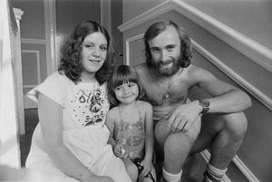 phil collins sitting to the right of his ex wife andrea bertorelli and their daughter