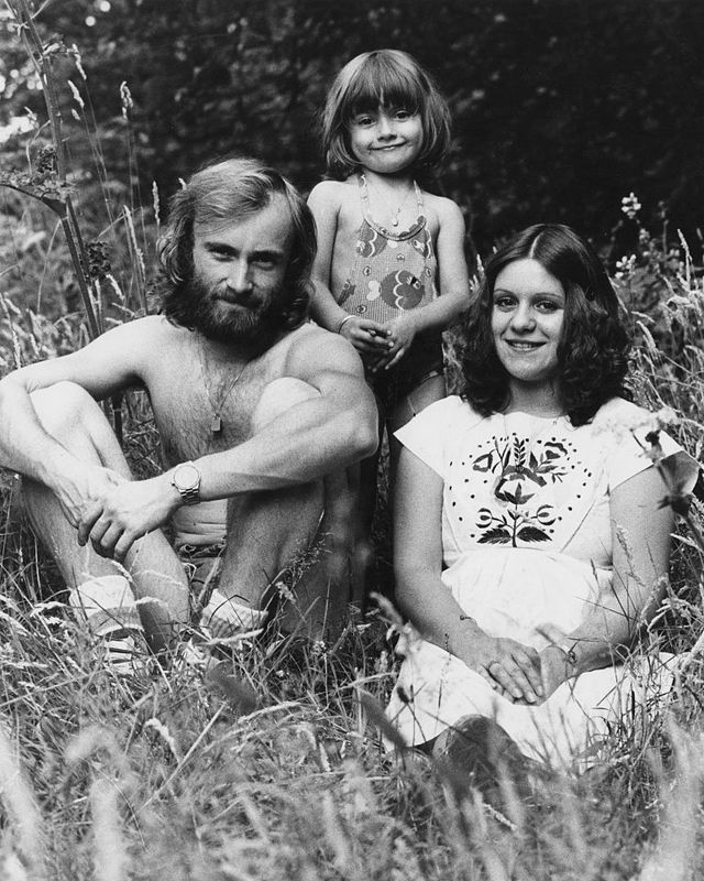 phil collins posing with his adopted daughter joely and his ex wife andrea bertorelli in a grassy field