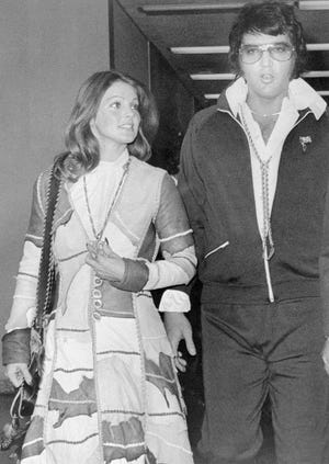 elvis and priscilla presley leaving courtroom