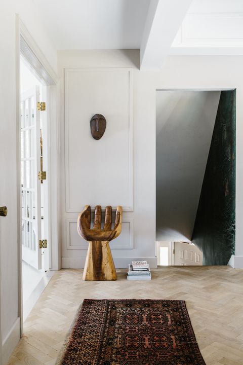 Hallway with hand-shaped chair