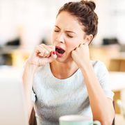 why do i wake up tired  entrepreneur yawning in office