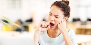 why do i wake up tired  entrepreneur yawning in office