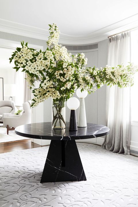 elegant entryway with a center table with florals
