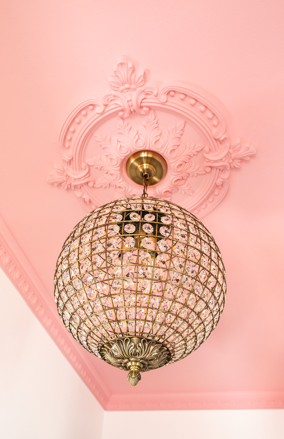 pink ceiling with chandelier