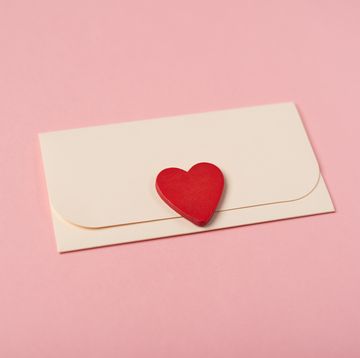envelope and red heart on the rose background