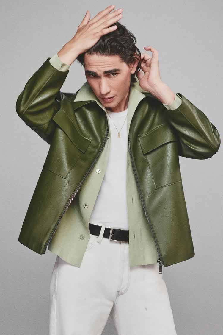 a person in a green jacket