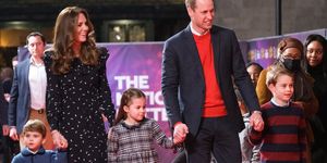 will, kate, george, charlotte, and louis walk a red carpet in holiday outfits