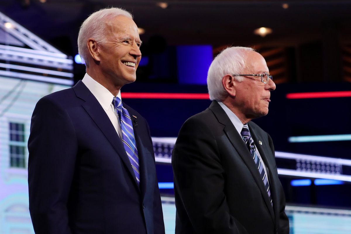 miami, florida   june 27 former vice president joe biden and sen bernie sanders i vt take the stage for the second night of the first democratic presidential debate on june 27, 2019 in miami, florida  a field of 20 democratic presidential candidates was split into two groups of 10 for the first debate of the 2020 election, taking place over two nights at knight concert hall of the adrienne arsht center for the performing arts of miami dade county, hosted by nbc news, msnbc, and telemundo photo by joe raedlegetty images