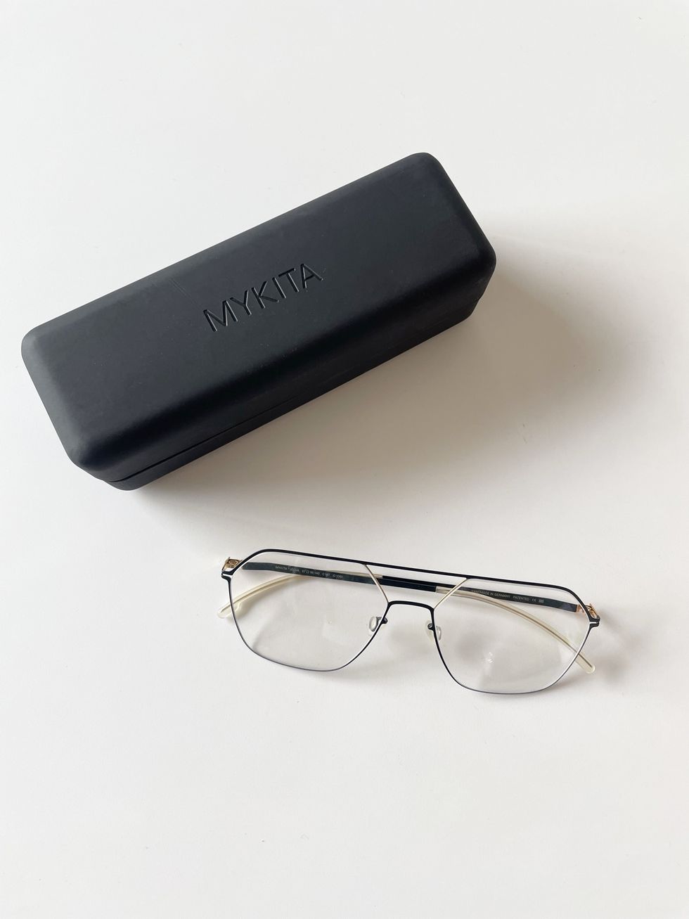 a black rectangular object with glasses