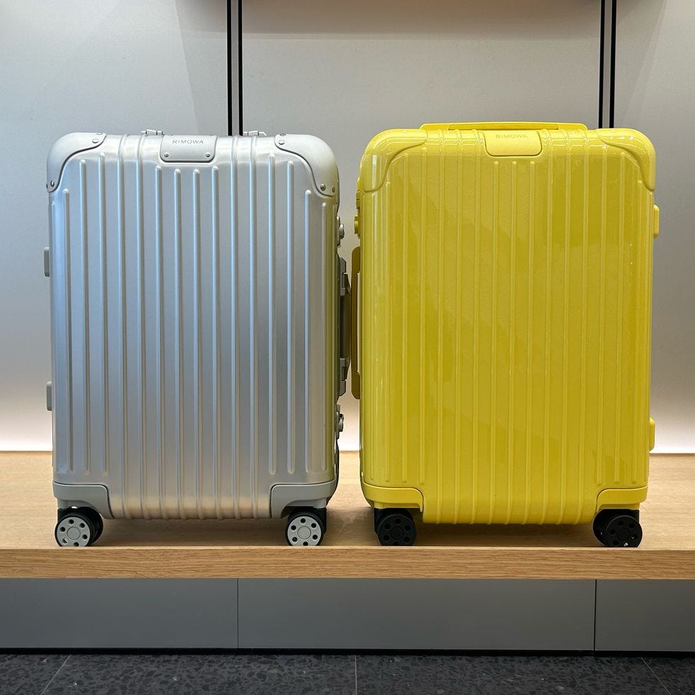 a couple of suitcases on wheels