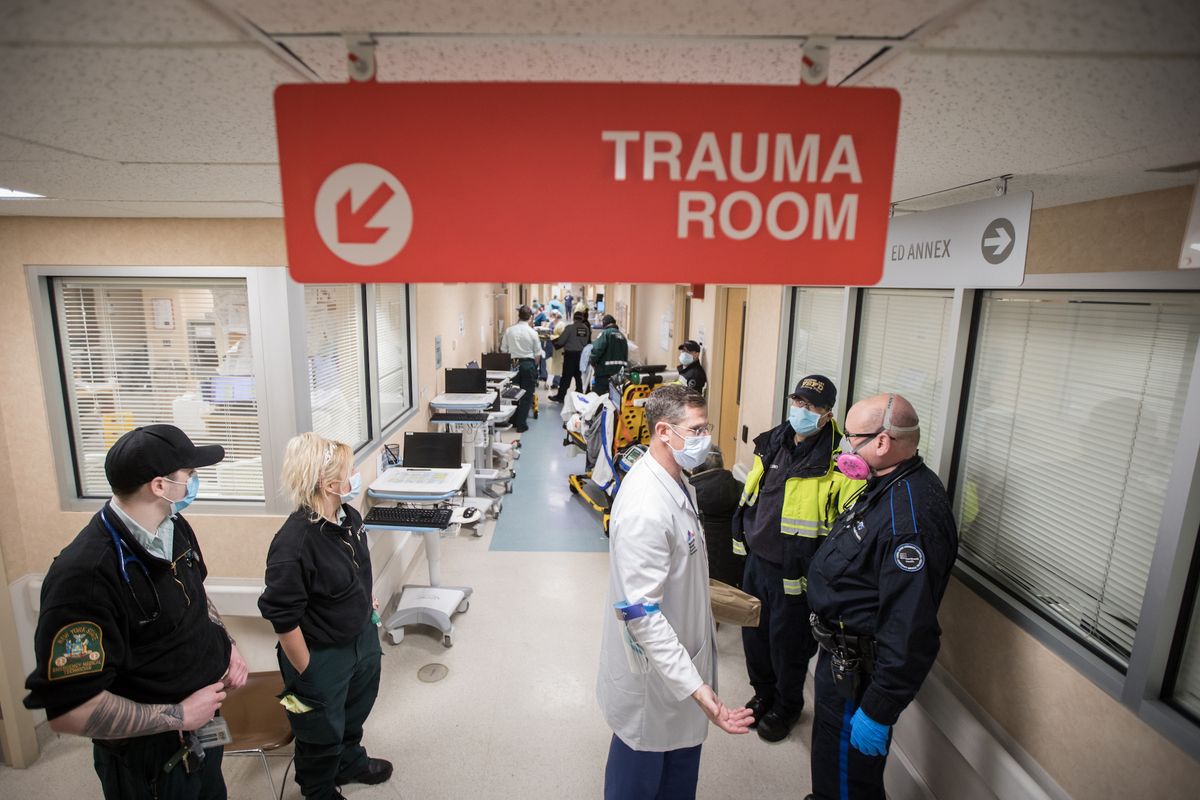 emergency department chief dr joshua kugler speaks with paramedics after they bring in a patient to mount sinai south nassau hopsital in oceanside, on april 13, 2020