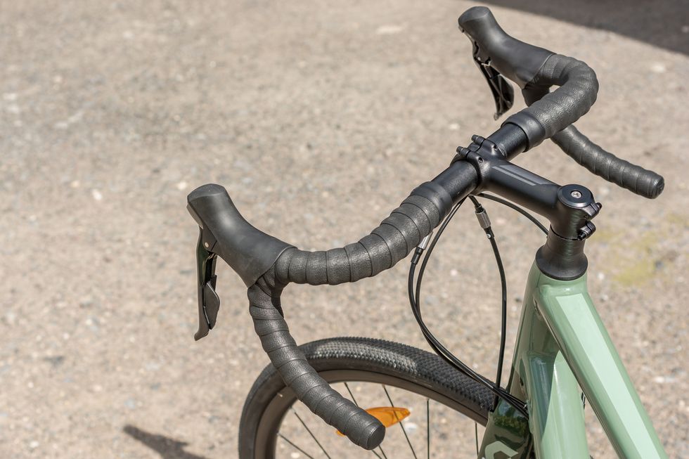 Ergonomically shaped handlebar of a road bike with brake lever and gear lever