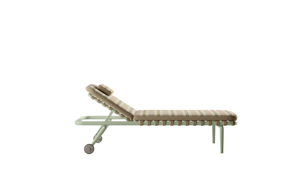 a sun lounger with stripy cushions