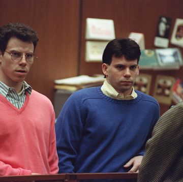 erik and lyle menendez sitting in a courtroom