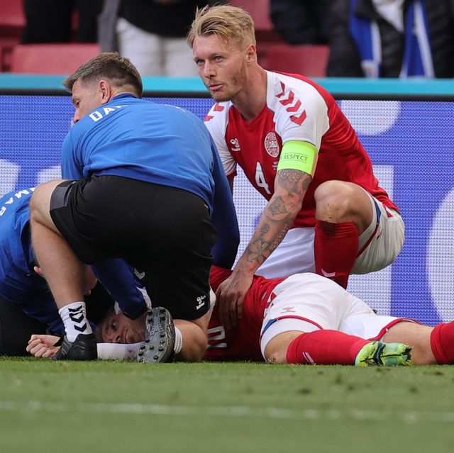 topshot   denmarks midfielder christian eriksen bottom c receives medical attention after collapsing on the pitch during the uefa euro 2020 group b football match between denmark and finland at the parken stadium in copenhagen on june 12, 2021 photo by friedemann vogel  various sources  afp photo by friedemann vogelafp via getty images