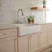 peachy pink paint on kitchen cabinets