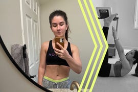 a person posing in front of a mirror and exercising in a gym environment