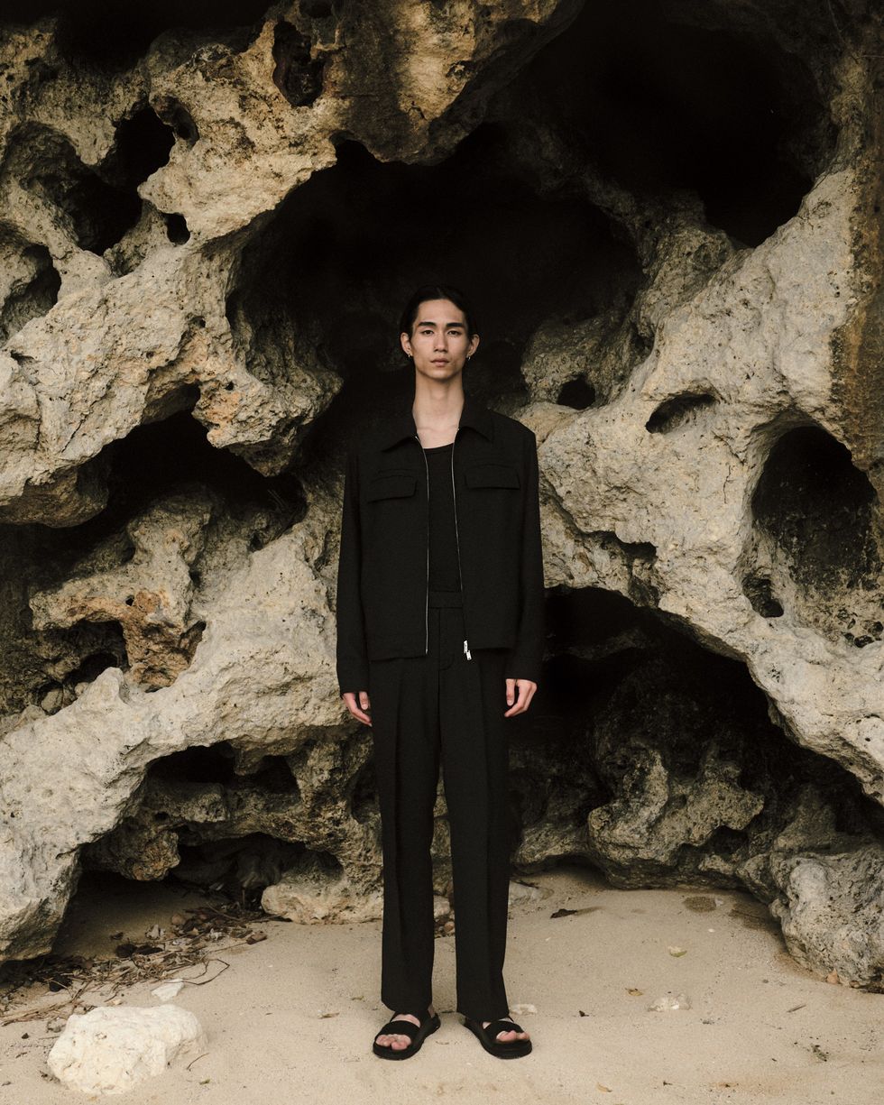 a person standing in a cave