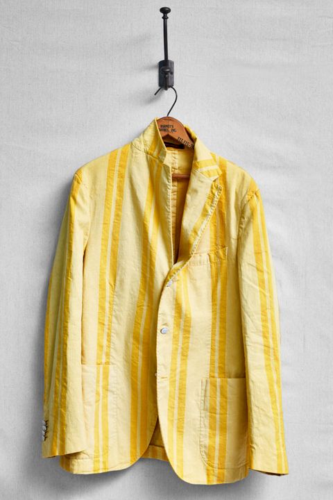 Clothing, Clothes hanger, Yellow, Outerwear, Jacket, Sleeve, Blazer, Beige, Textile, Top, 