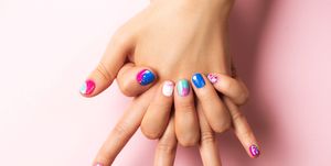 playful abstract summer manicure in blue and purple colors flat lay style