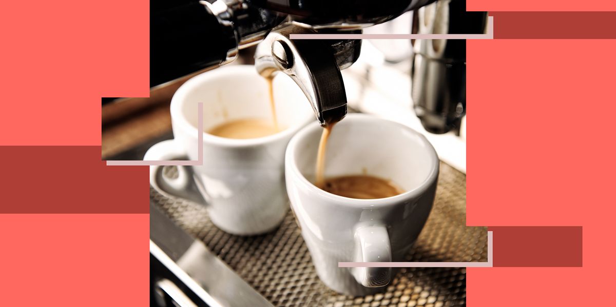 espresso machine filling two small white mugs