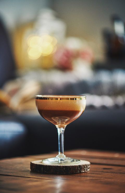 espresso martini cocktail on coffee table in indoor setting