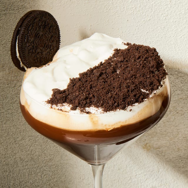 Espresso Mocha Crunch Mocktail espresso mocha crunch mocktail in a martini glass with a whipped cream and chocolate topping and oreo garnish