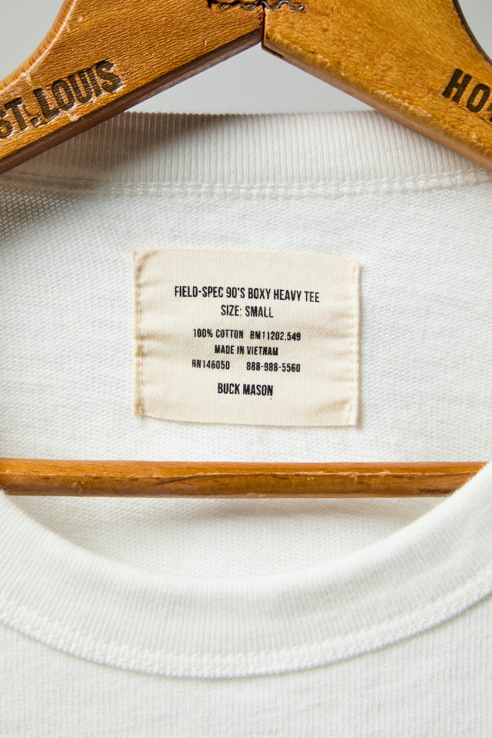 the ribbed neckline of a white t shirt