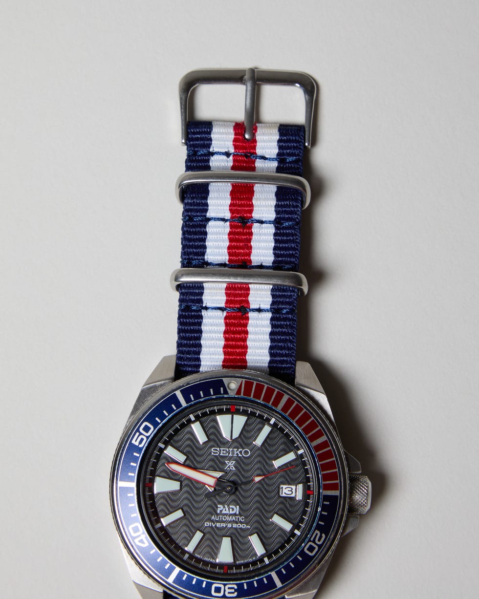 a red white and blue nato watch strap on a seiko watch