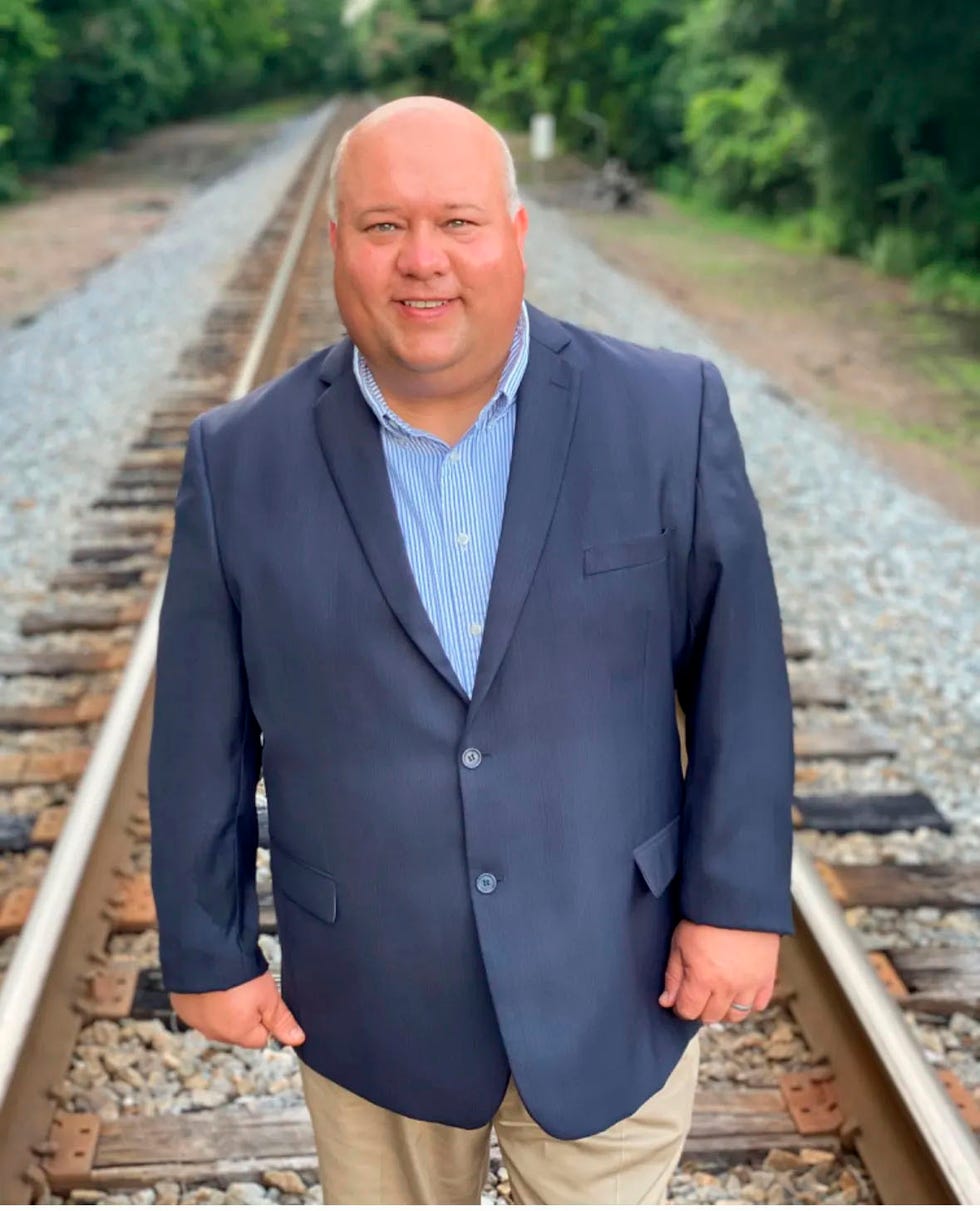 a man standing on train tracks