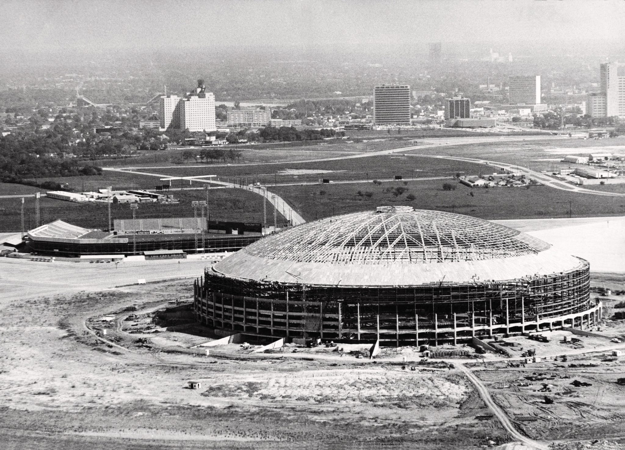 the harris county domed stadium is shown in 1964, several months before it was opened. the old colt stadium, which was home to houston's heat, mosquitoes and colt .45s baseball team, stands at upper left. (ap photo/houston chronicle, sam c. pierson)