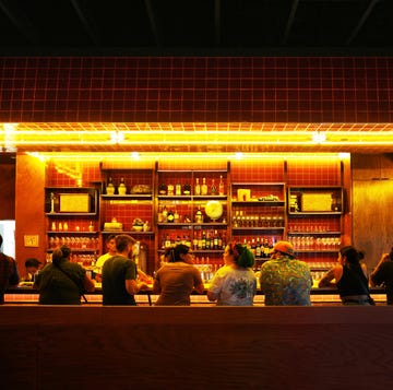 a group of people sitting at a bar