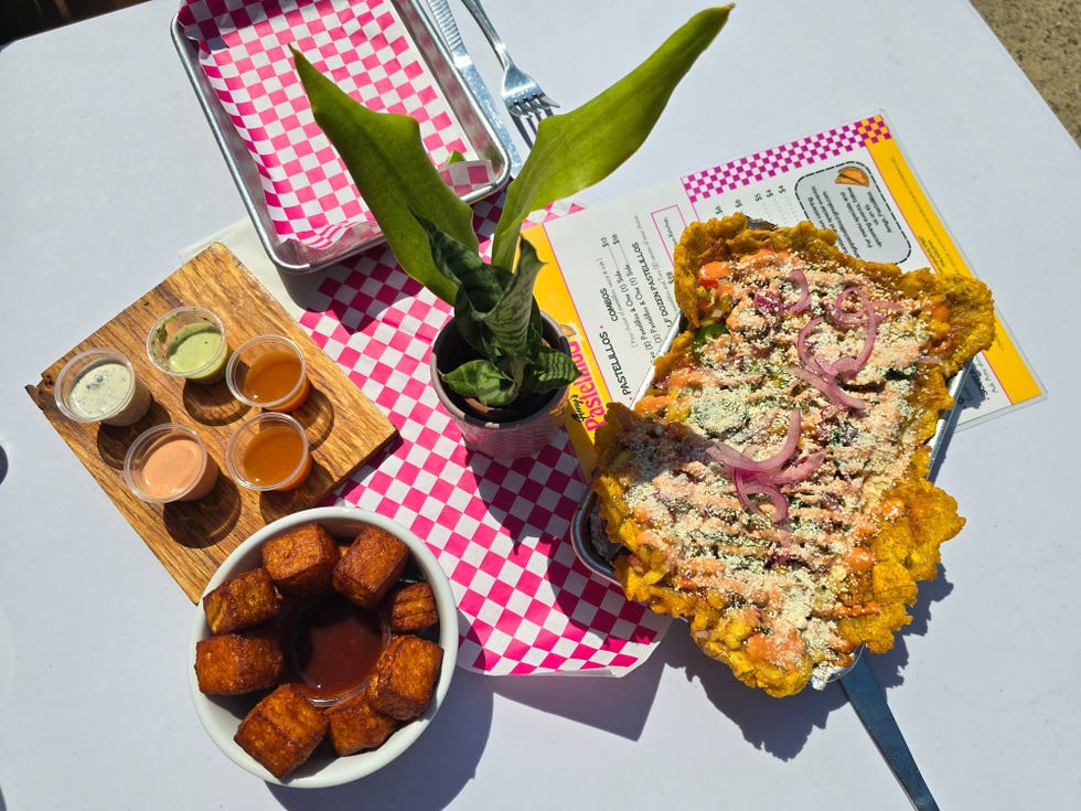 a vibrant display of food and condiments on a table highlighting a unique dish alongside sides