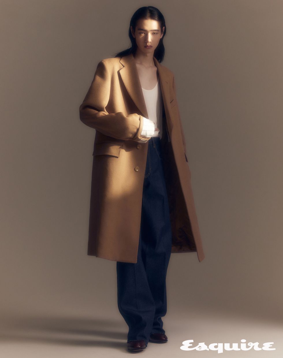 a person wearing a long coat