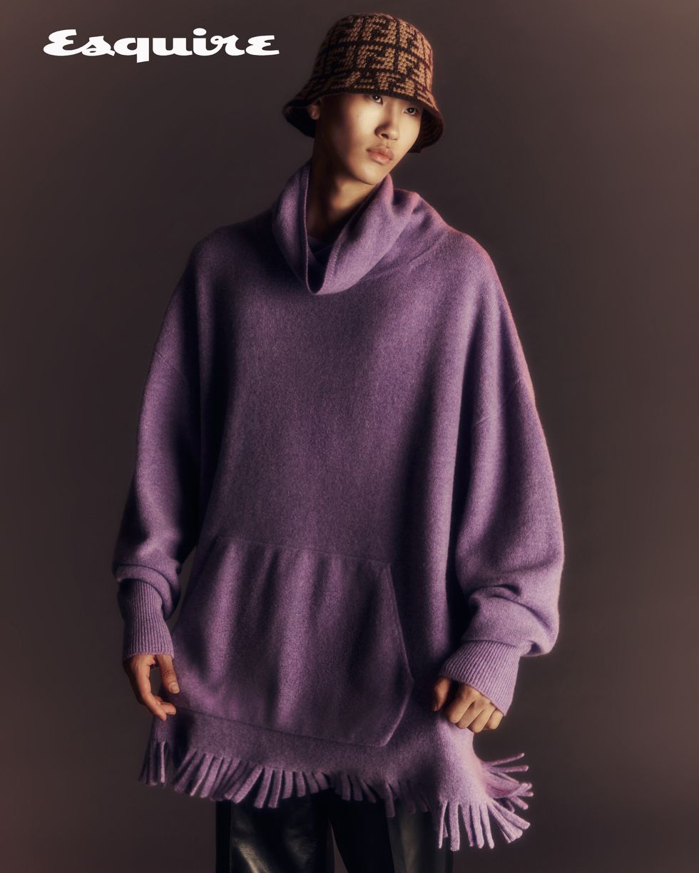 a person wearing a purple sweater
