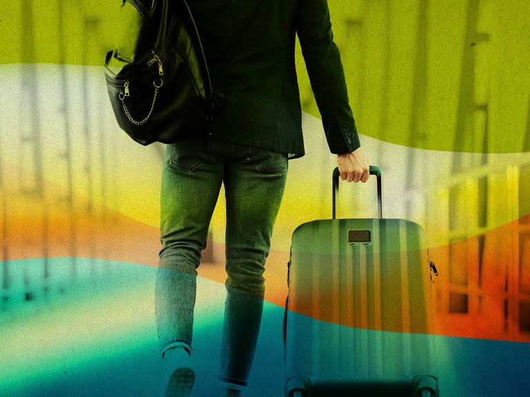 man walking with suitcase