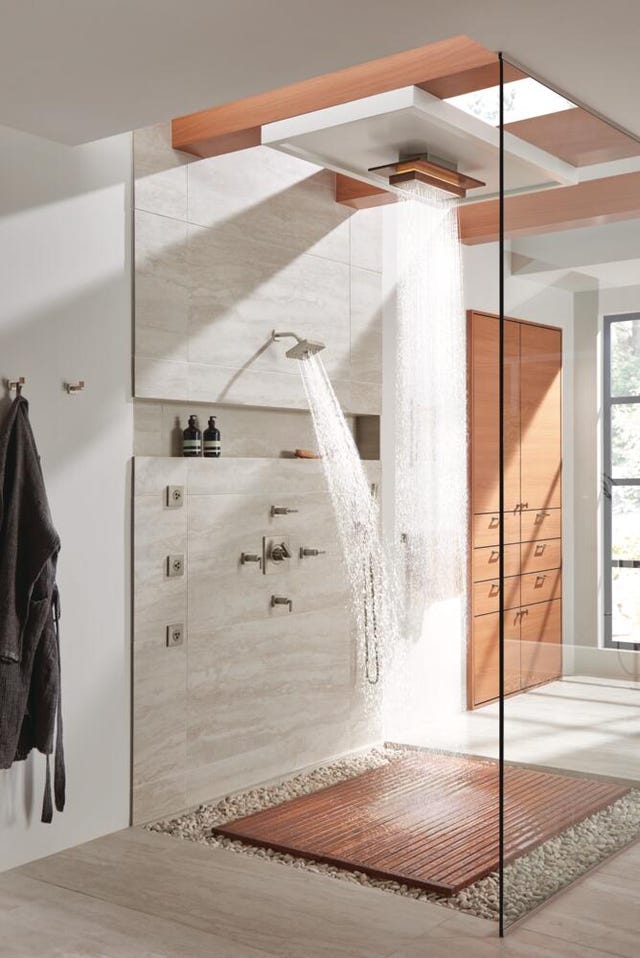 modern shower area featuring a rainfall showerhead and wooden flooring