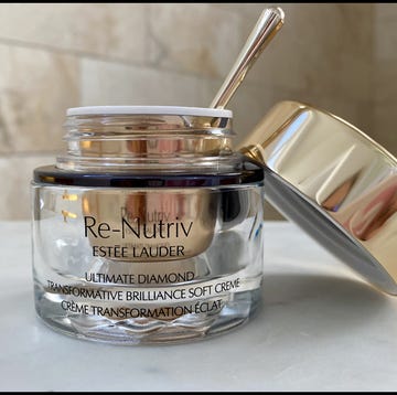 a glass jar with a metal handle a glass jar with a metal handle