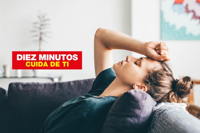 sad and depressed woman sitting on sofa at home
